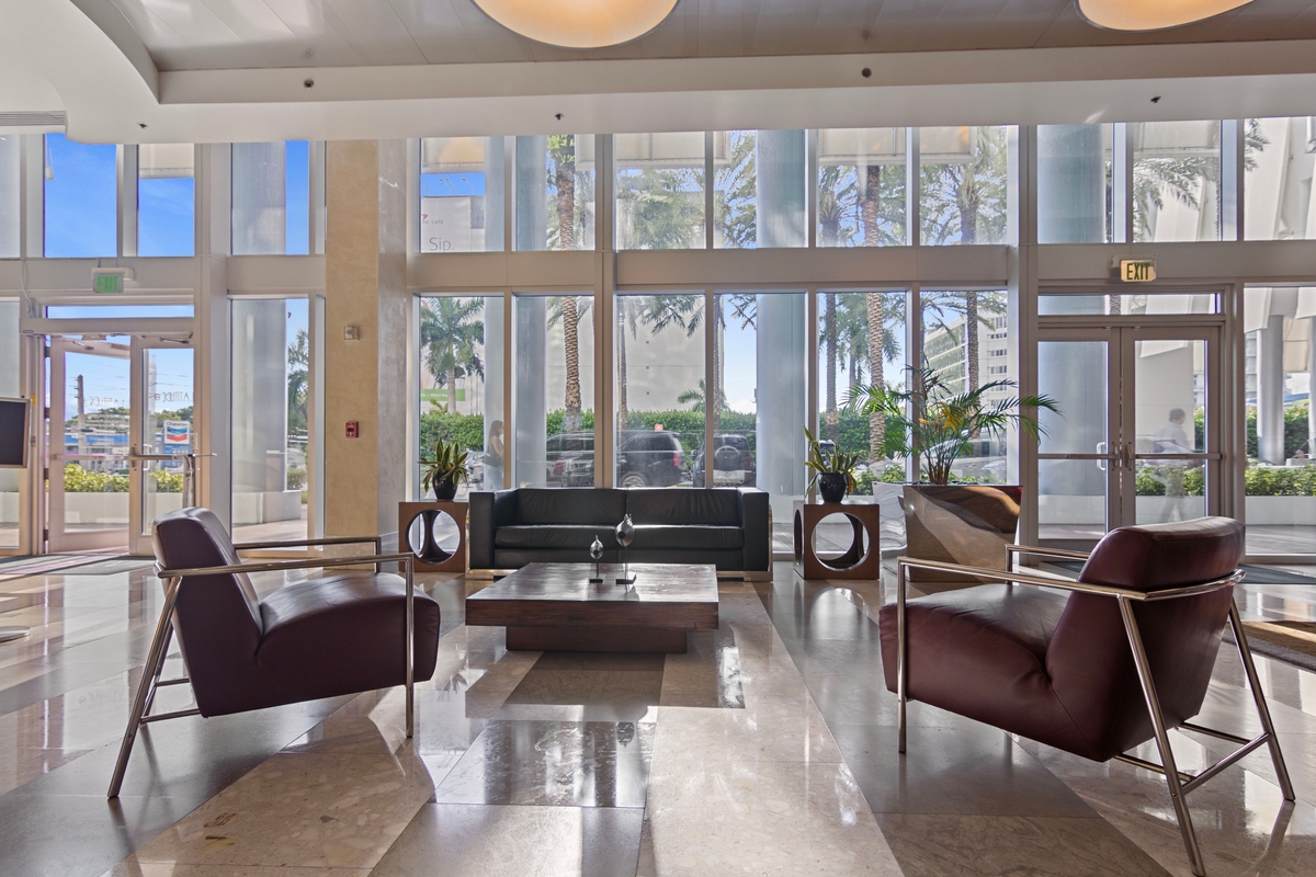 Latitude One lobby lounge with curtain-wall glazing
