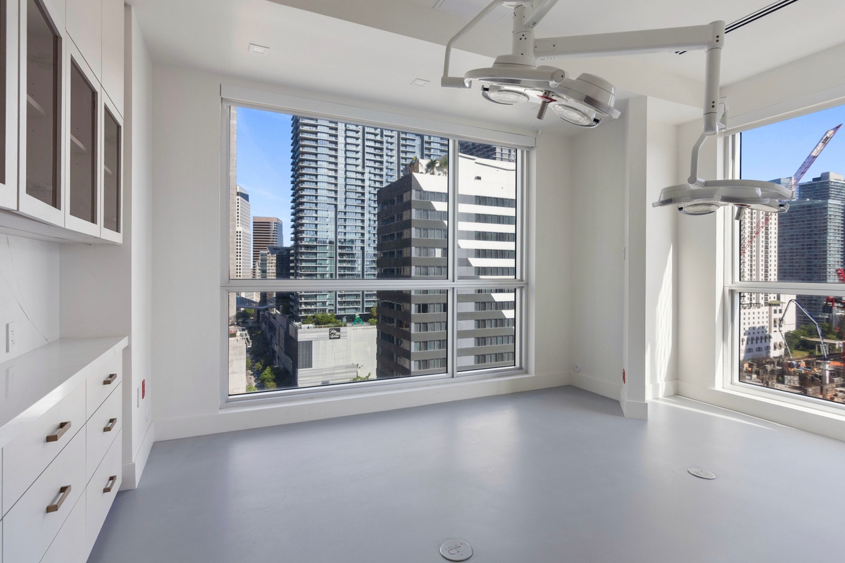 Second purpose-built procedure room with equipment arm and floor-to-ceiling windows